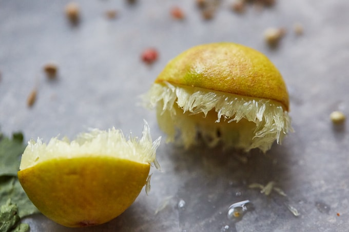 Closeup shot of the lemon and coriander seeds used to make Chicken Pakora.